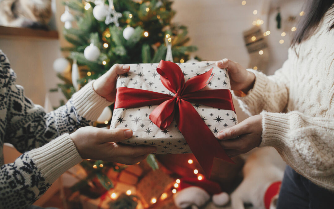 What is the proper etiquette for a nanny when it comes to giving Christmas gifts to their charges and employers?